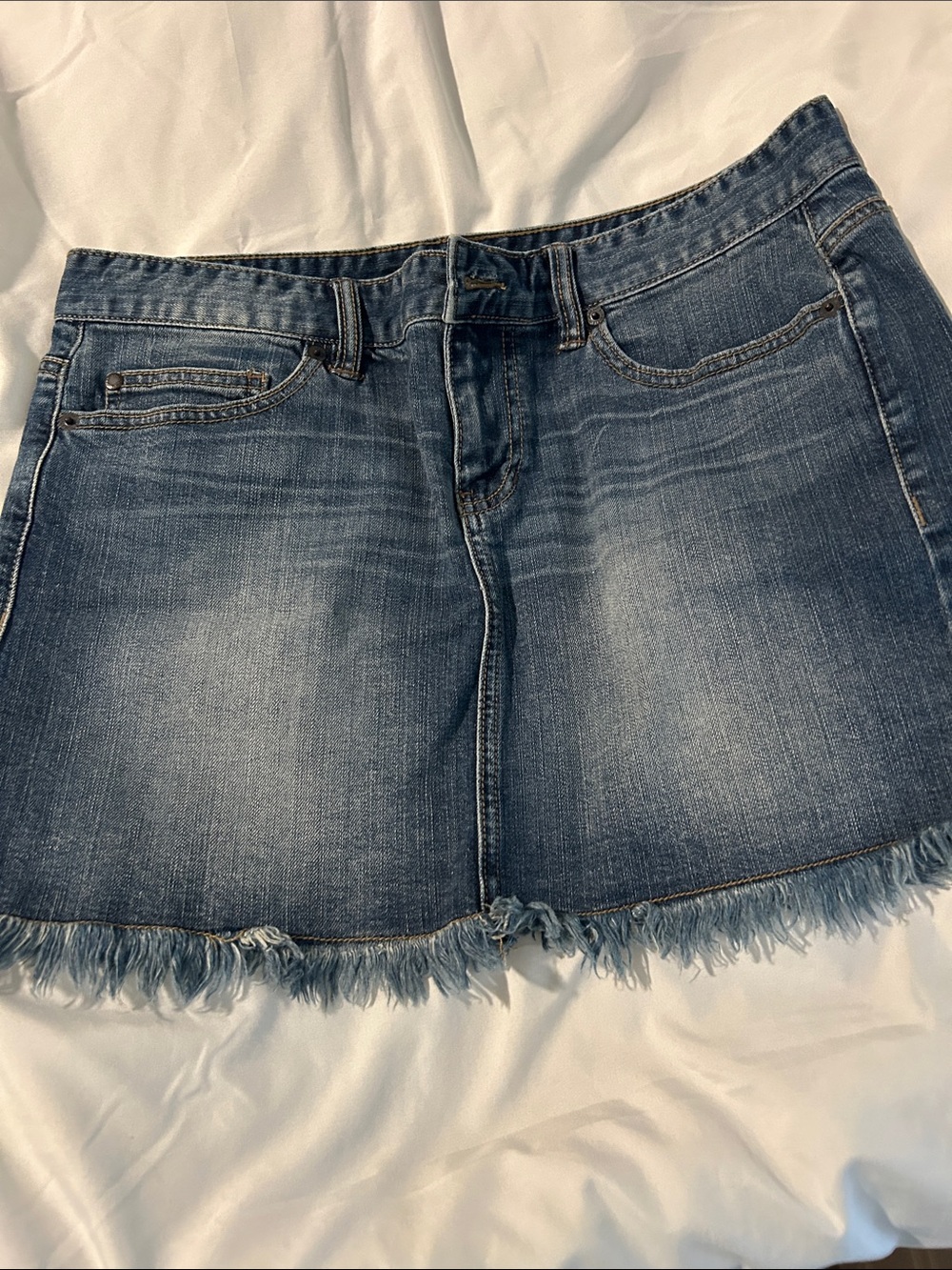 Calvin Klein jean skirt with Fringe style bottom of skirt